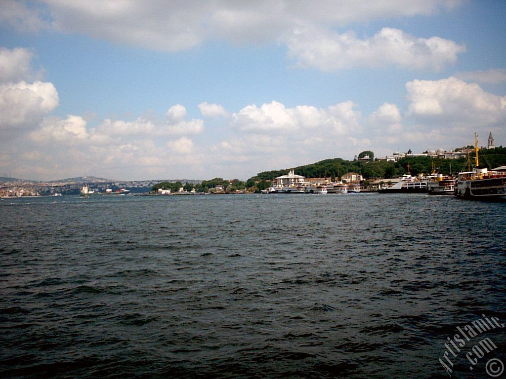 View of the ships on the jetties and Topkapi Palace on the rigt-middle from the shore of Eminonu in Istanbul city of Turkey.
